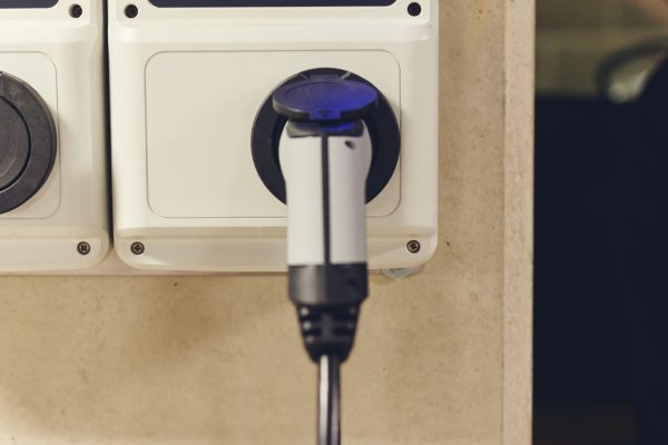 Electric car charging home garage on rapid charger